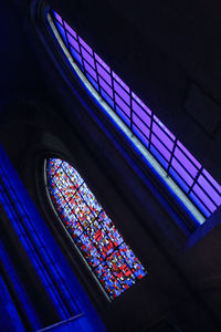Low angle view of illuminated lights at night