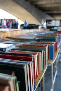 Row of books in shelf at market