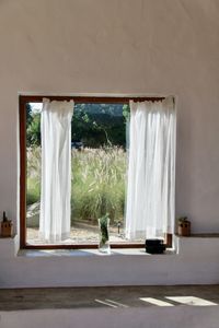 White curtain hanging on window at home