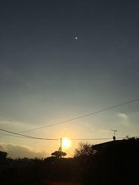 Low angle view of silhouette birds against sky during sunset