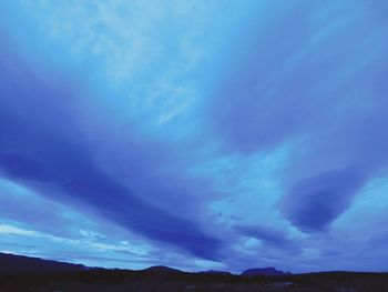 Scenic view of landscape against blue sky