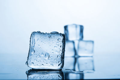 Close-up of ice cubes against white background