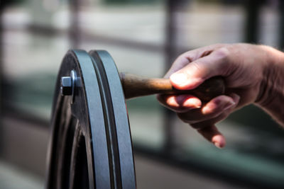 Close-up of hand holding ring