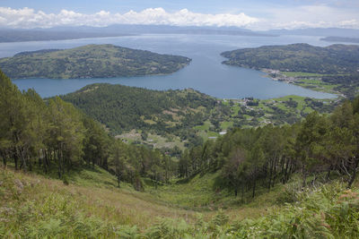 Scenic view of landscape and mountains against sky