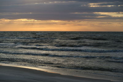 Scenic view of sea against sky during sunset