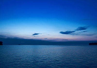 Scenic view of sea against sky at sunset