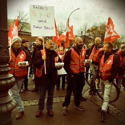 Group of people standing in front of street