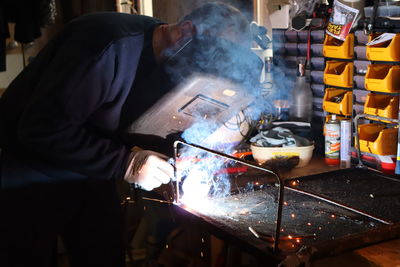 Manual worker working in workshop