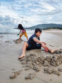 Kids playing sands on the beach