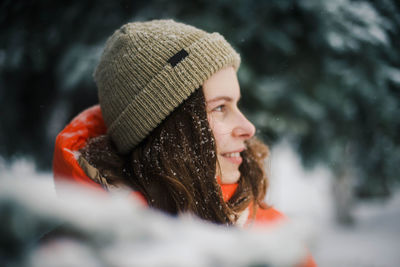 Close-up of woman looking away during winter