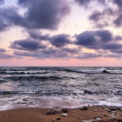 Scenic view of sea against cloudy sky