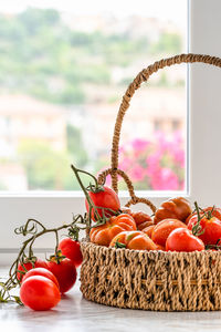 Close-up of tomatoes in basket on table