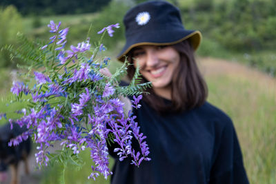 Side view of woman wearing hat