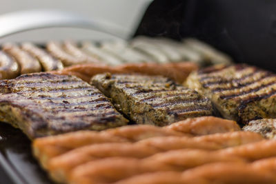 Close-up of meat on barbecue grill