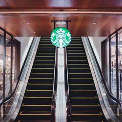 Low angle view of illuminated escalator in building