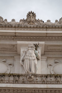 Low angle view of statue against building
