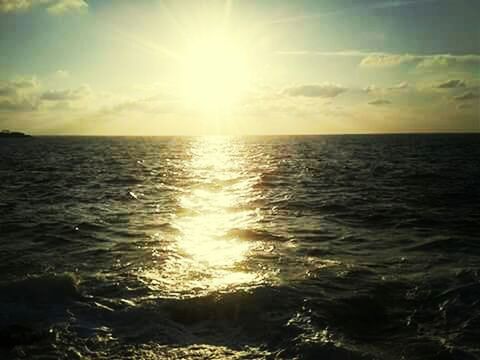 sea, sunbeam, sun, sunlight, nature, scenics, tranquil scene, bright, sunset, sky, beauty in nature, reflection, idyllic, water, shiny, brightly lit, freedom, vibrant color, horizon over water, backgrounds, tropical climate, travel, cloud - sky, horizon, spirituality, summer, purity, tranquility, vacations, gold colored, no people, outdoors, landscape, beauty, sailing, saturated color, day