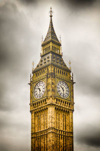 Low angle view of clock tower against sky