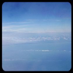 Scenic view of landscape against blue sky