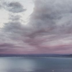 Scenic view of sea against dramatic sky