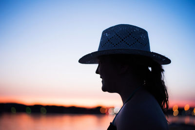 Side view of woman against clear sky