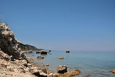 Scenic view of sea against clear blue sky