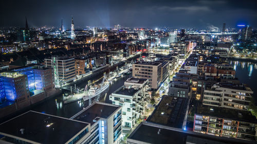 High angle view of illuminated cityscape against sky