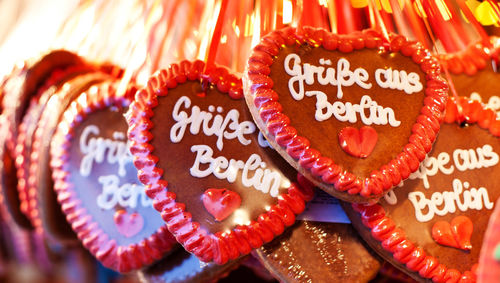 Close-up of heart shape gingerbreads with text for sale at market