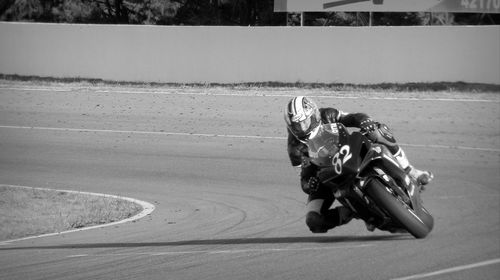 People riding motorcycle on road