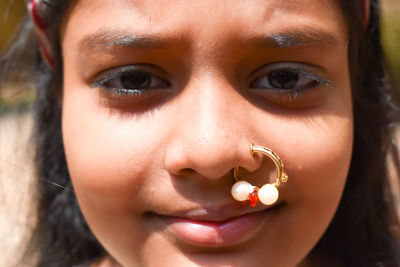 Close-up portrait of girl wearing nose ring