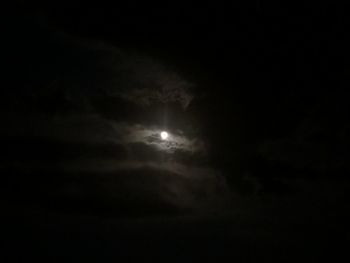 Low angle view of moon in sky at night