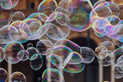 Close-up of bubbles flying in city