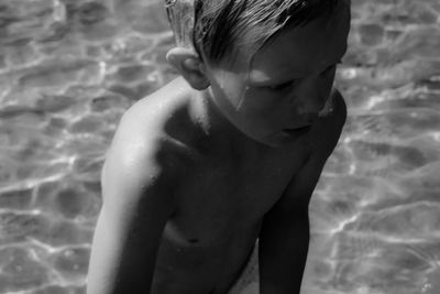 Full length of shirtless boy in swimming pool