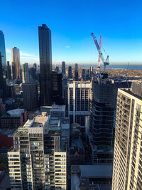 Modern buildings in city against sky