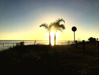 Scenic view of beach against sky during sunset