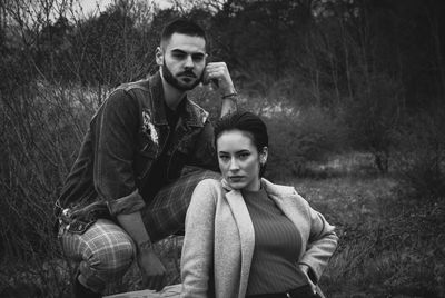 Portrait of young man sitting outdoors