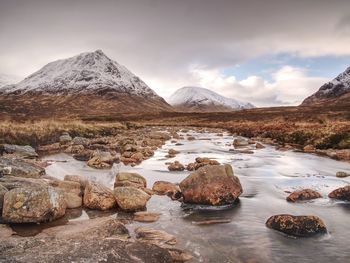 Cold day on meadow at river coupall at delta to river etive near glencoe in the scottish highlands