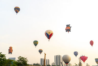 Low angle view of hot air balloons against sky