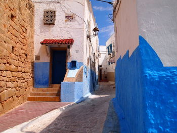 Empty alley amidst buildings