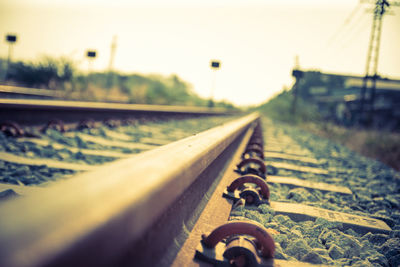 Close-up of railroad track against clear sky