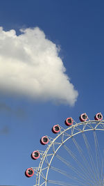 Low angle view of ferris wheel against sky