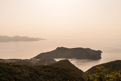 Scenic view of sea against clear sky during sunset