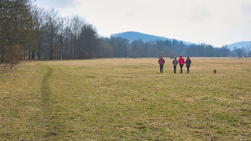 People on field against sky