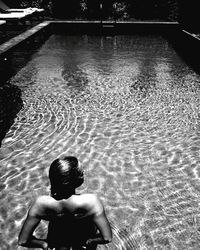 Reflection of woman in water