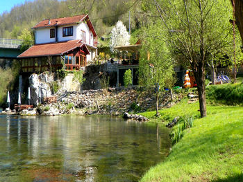 Scenic view of lake by building