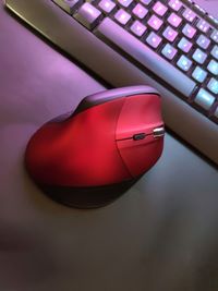 High angle view of red laptop on table