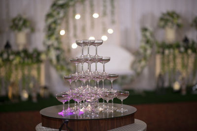 Close-up of stack of wine glasses on table