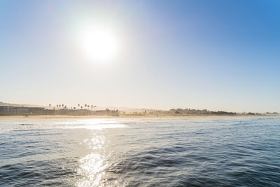 Scenic view of sea against clear sky on sunny day