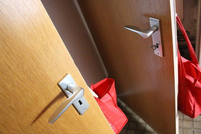 High angle view of paper hanging on wall at home