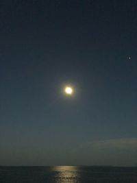 Scenic view of sea against sky at night